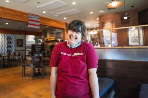 An intellectually disabled person employed at a store.