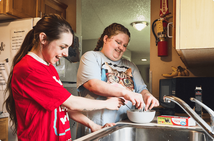 young-adult-with-developmental-disabilities-works-on-life-skills-through-cooking