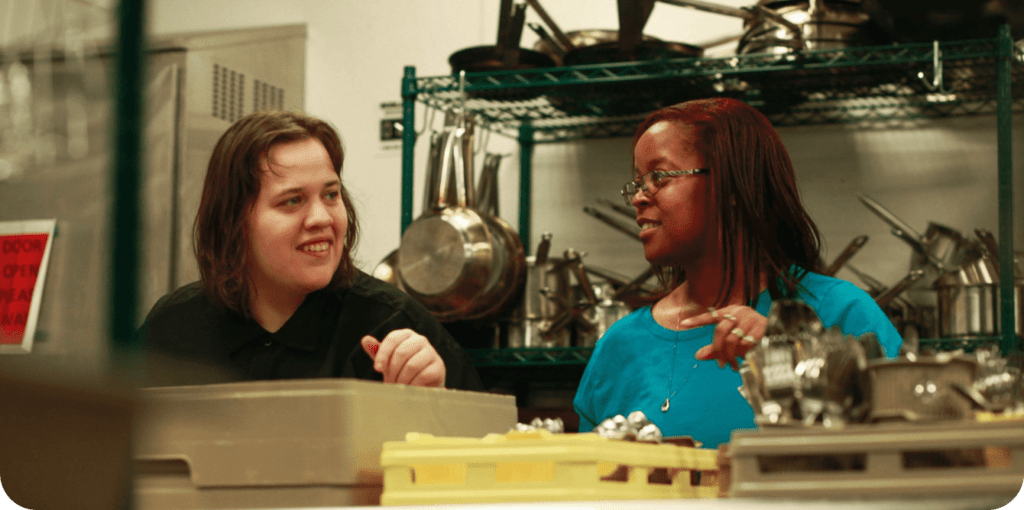 person-with-intellectual-or-developmental-disabilities-works-in-the-kitchen-with-an-also-employee