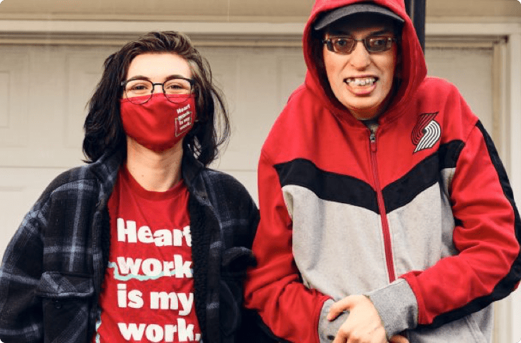 young-adult-with intellectual-or-developmental-disabilities-poses-with-a-dsp-outside